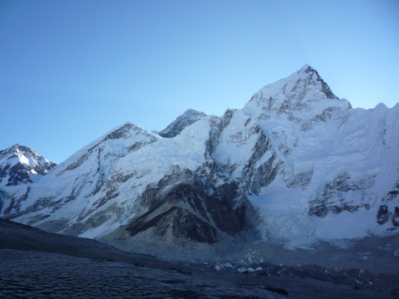 P1000611.JPG - Within 20 minutes of climbing, Everest appears. The sun is still behind Nuptse (which seems higher than Everest in this picture). Changtse is at far left.