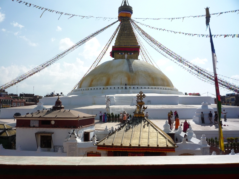 P1000732.JPG - On the eastern side of Kathmandu is Boudhnath stupa, one of the world's largest. It is believed that the current stupa, built on the site of an older stupa, was built after the depredation of the Mughal invaders in the 14th century. Stupas were originally built to house holy relics but it is uncertain if there is anything interred at Boudhnath.