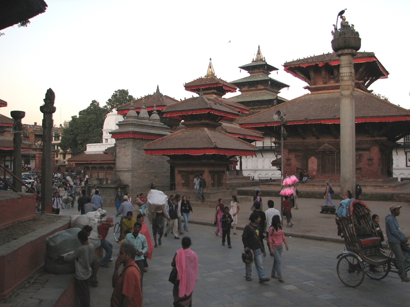 IMG_7963.JPG - Entrance to Kathmandu's main Durbar Square, a complex of courtyards, palaces and temples that was once the seat of the Malla kings. The square is the traditional heart of the old town and Kathmandu's most spectacular legacy of the traditional Newari architecutre. It is not an enclosed space, the streets running through it are used by pedestrians and vehicles to get from one part of the city to another. Most of the square dates from the 17th and 18th century. The entire square was designated a UNESCO World Heritage Monument in 1979