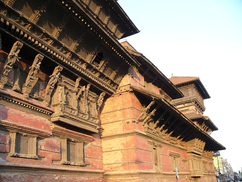 P1100397.JPG - The Kumari Ghar building, in the style of the Buddhist viharas of the valley, was built in 1757 by Jaya Prakash Malla. Inside the building is a three storey couryard or Kumari Chowk. It is enclosed by carved wooden balconies and windows.