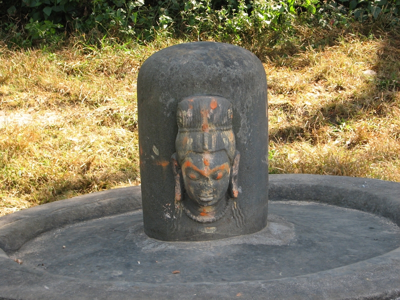 IMG_8447.JPG - Casually standing on one end of this grassy terrace is a Shiva lingam from the 5th or 6th century.