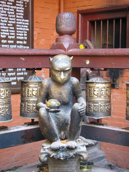 IMG_8484.JPG - The four corners of the courtyard have statues of lokeshvaras and four monkeys which hold out jackfruits as an offering.